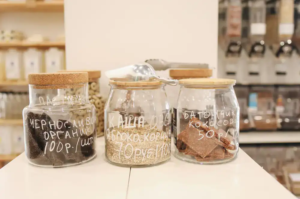 Checking out with filled jars at the shop counter